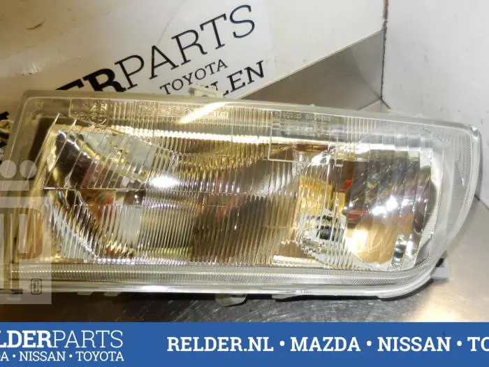 Headlight, left Nissan Primera
