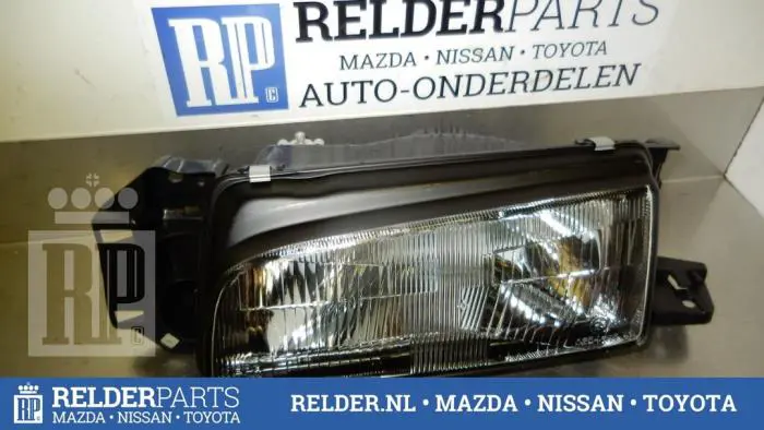 Headlight, left Mazda 323